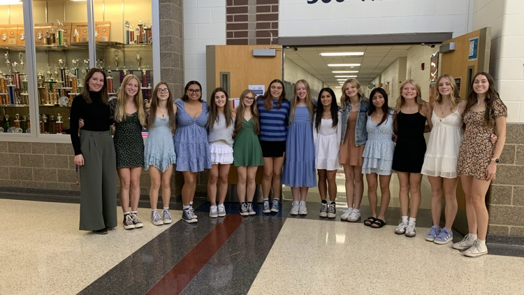 girls cross country team and coach