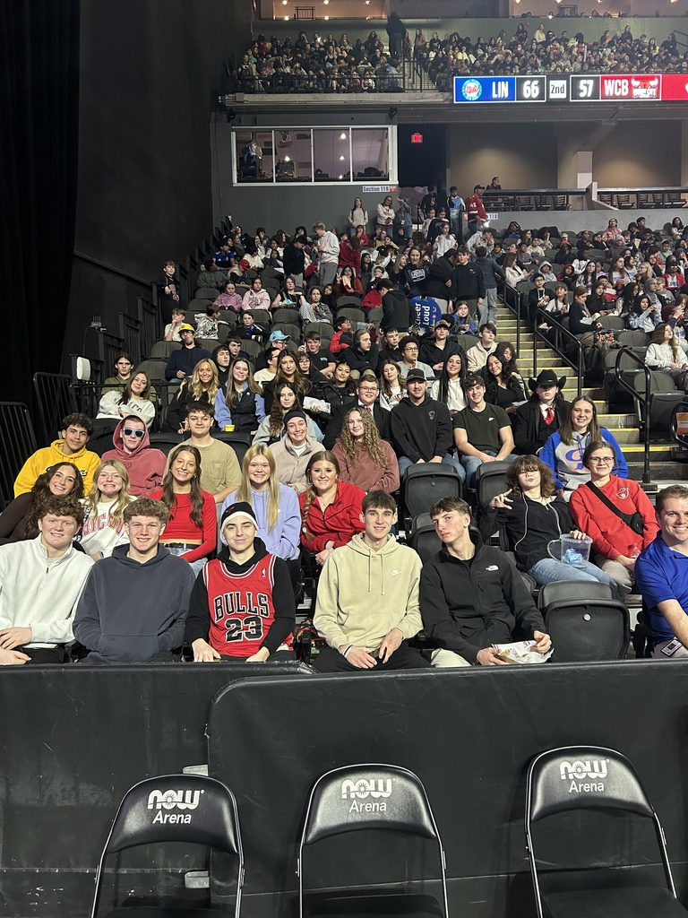 students and staff at game