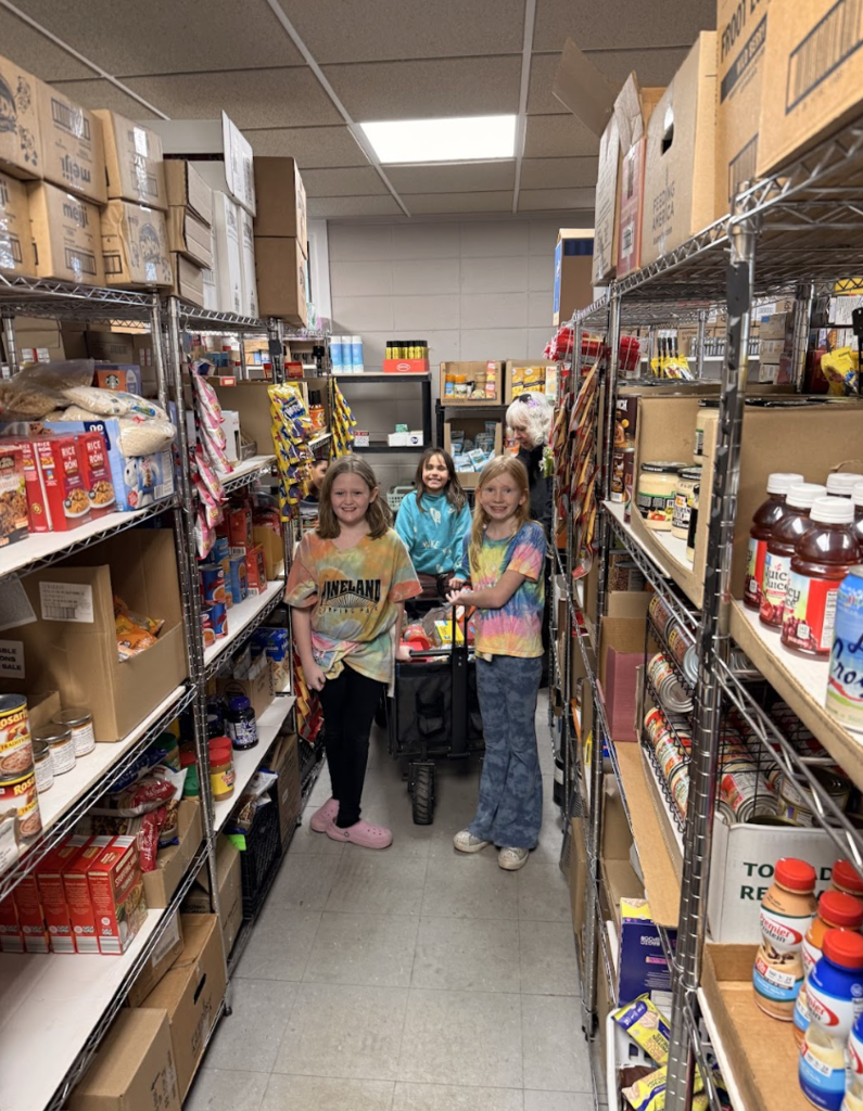 students walking through food pantry