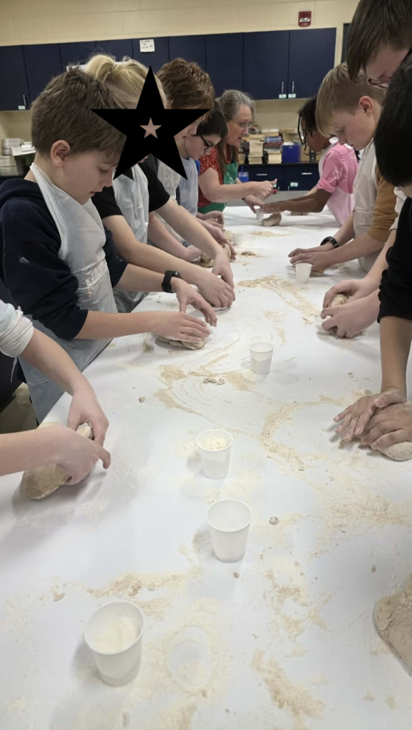 Students kneading dough