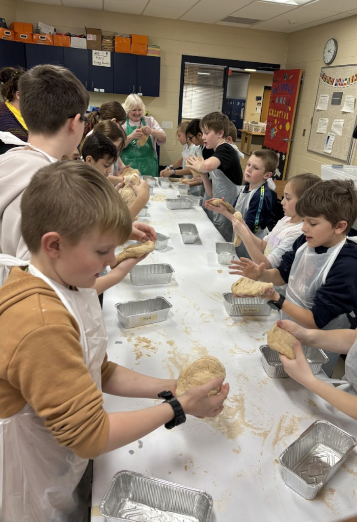 Students handling dough