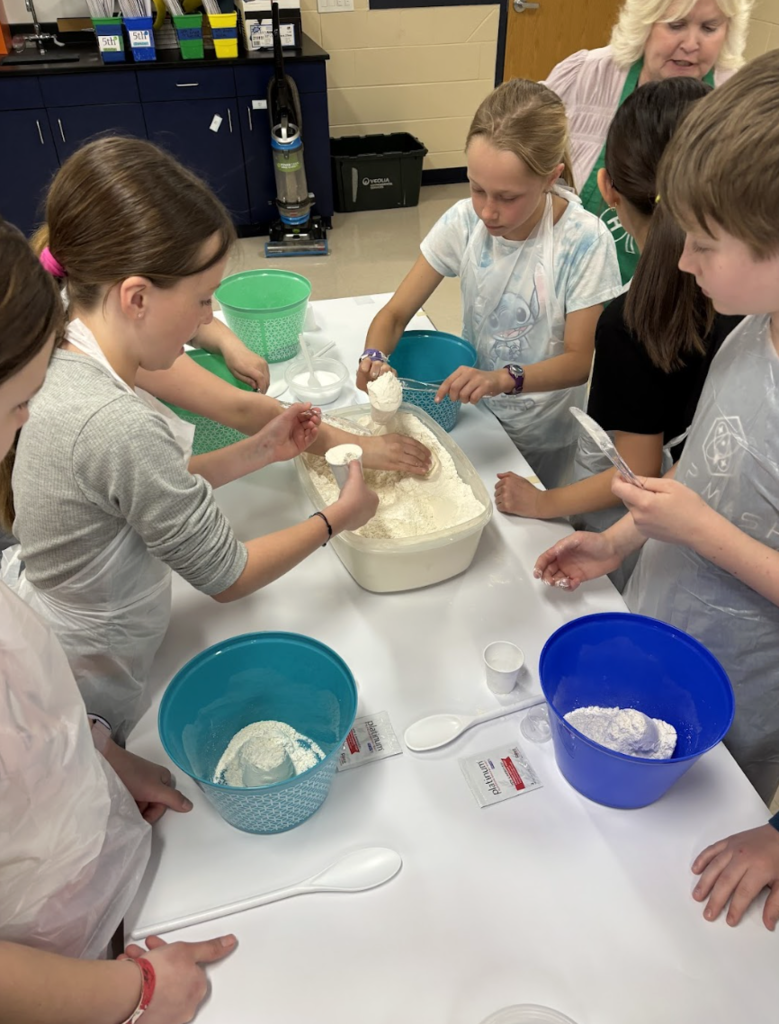Students churning butter