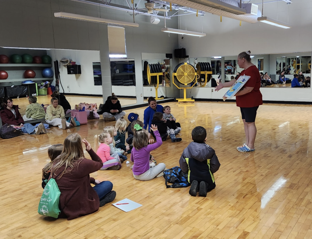 Students meeting with YMCA leader about water safety