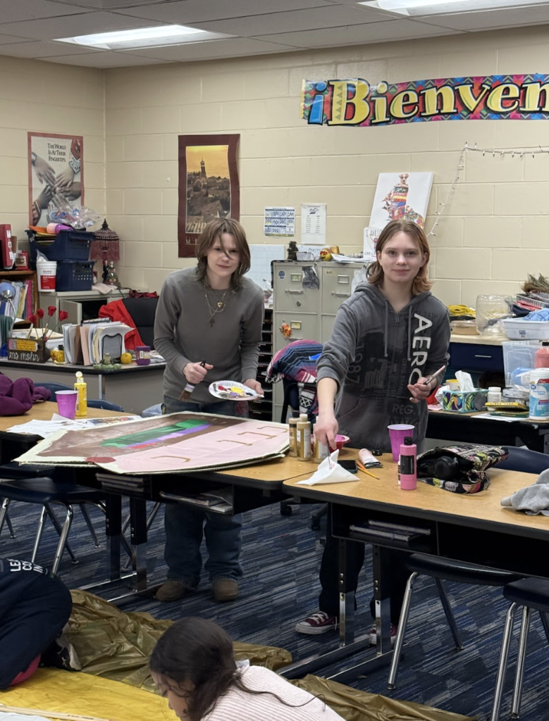 Students prepping paints for set creation