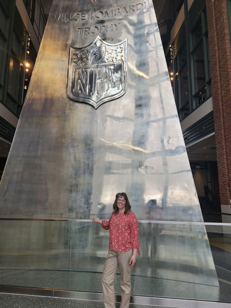Ms. Bullock with the Lombardi trophy