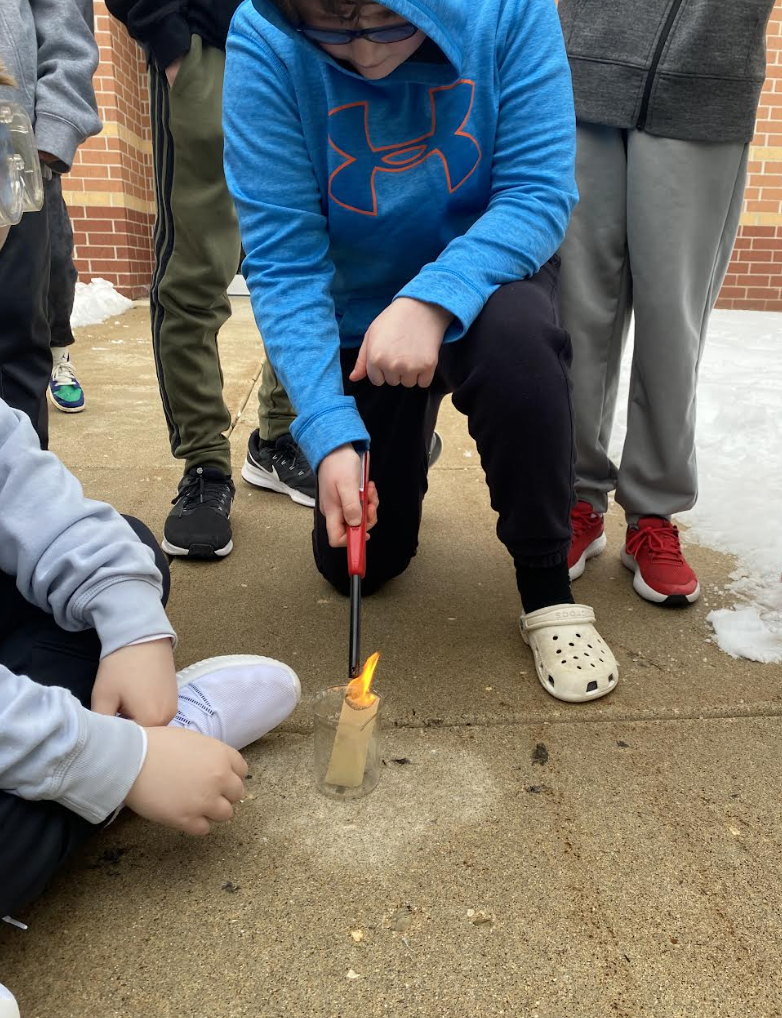 Students lighting tea bags on fire to show convection - picture 2