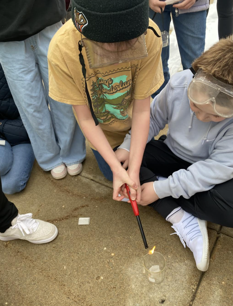 Students lighting tea bags on fire to show convection - picture 3