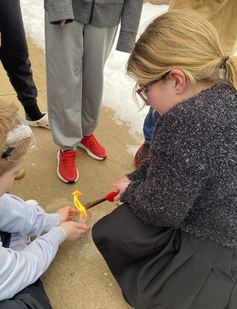 Students lighting tea bags on fire to show convection - picture 1
