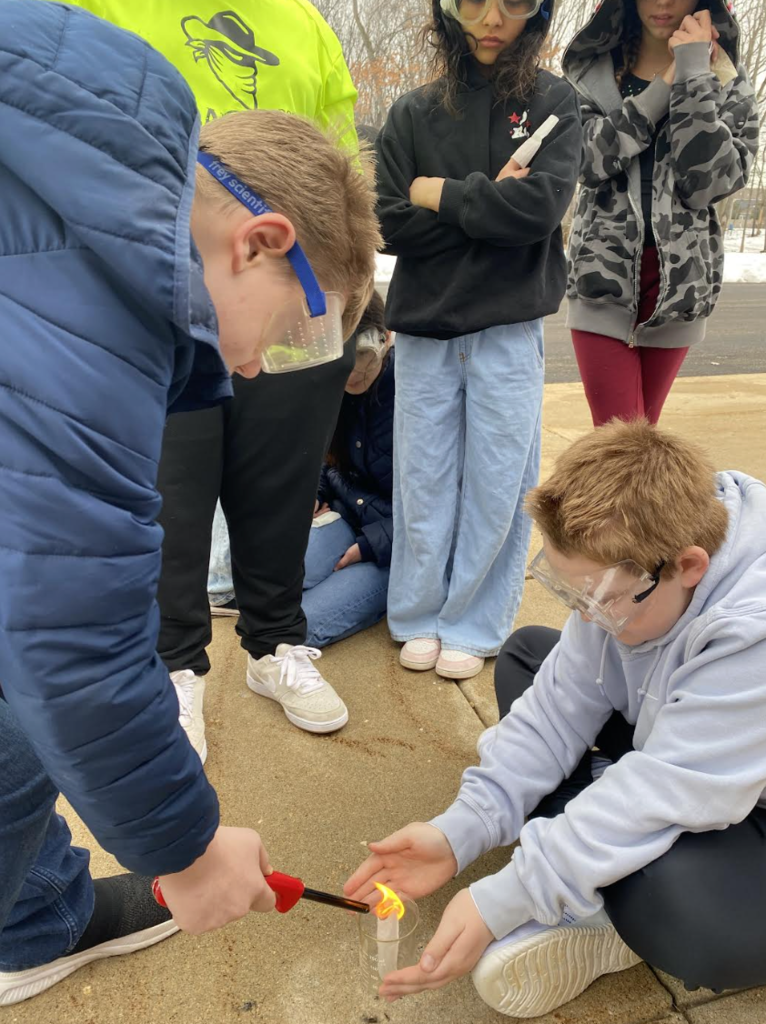 Students lighting tea bags on fire to show convection - picture 5
