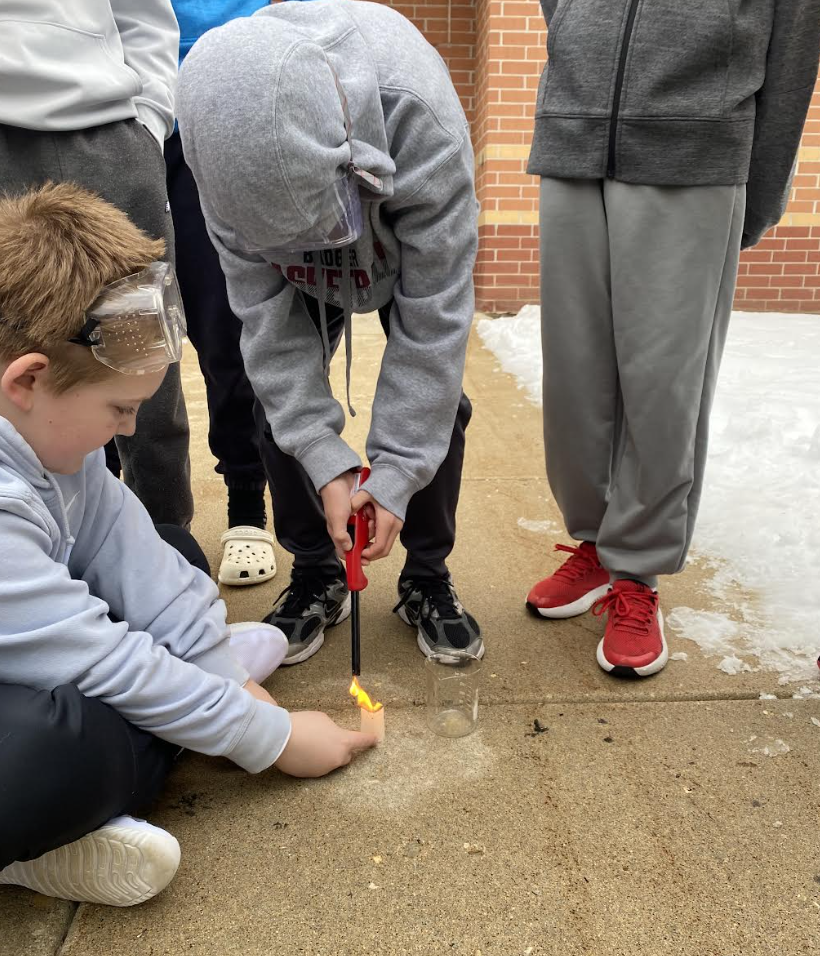 Students lighting tea bags on fire to show convection - picture 4