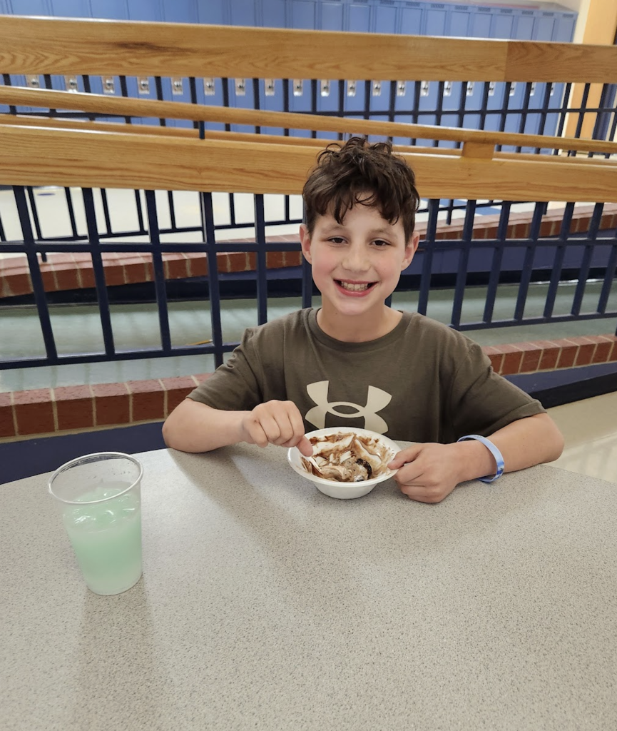 Student enjoying their purchases from entrepreneurship sale