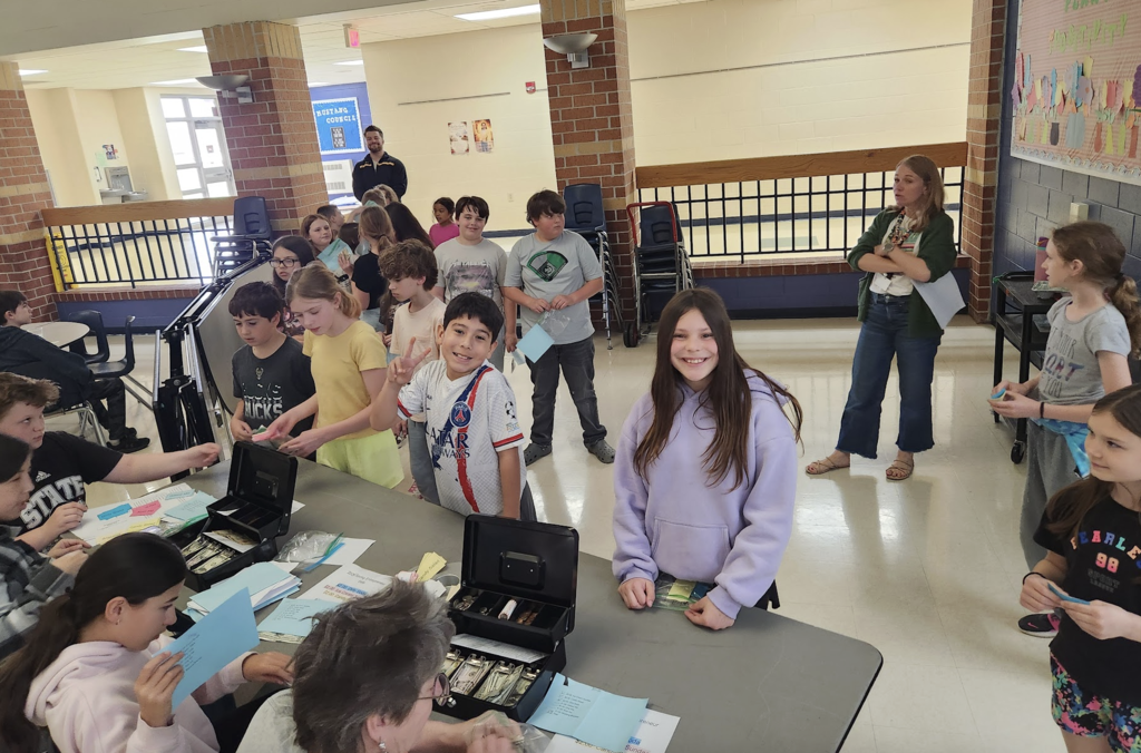 Students lining up to purchase tickets during the entrepreneurship sale