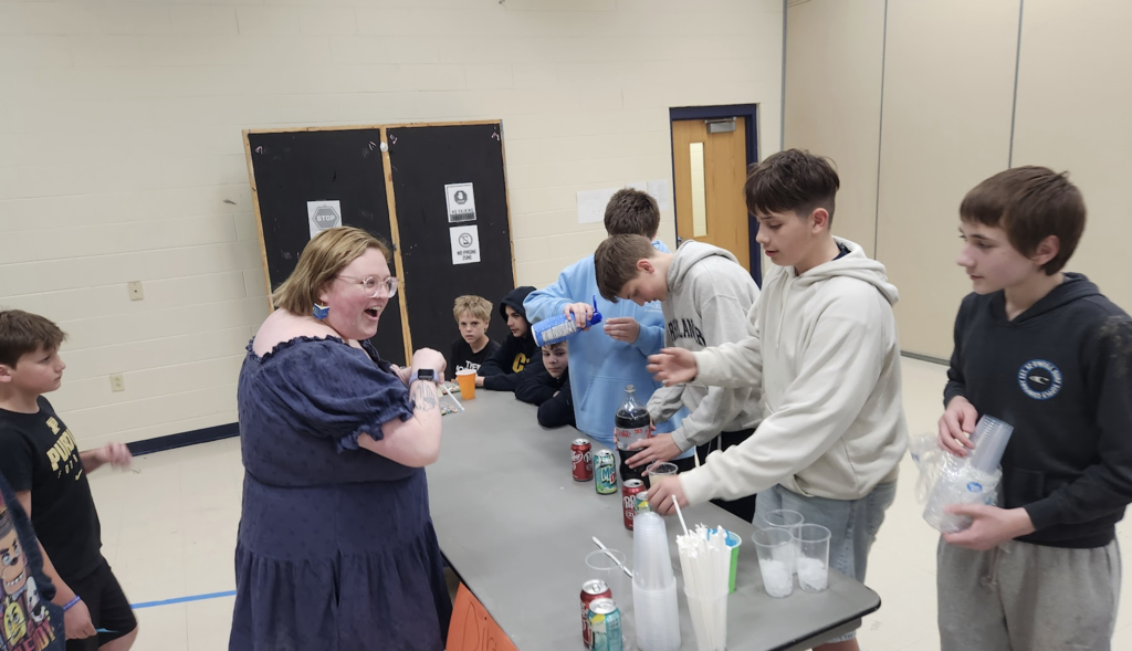 Group of students during entrepreneurship sale selling  drinks