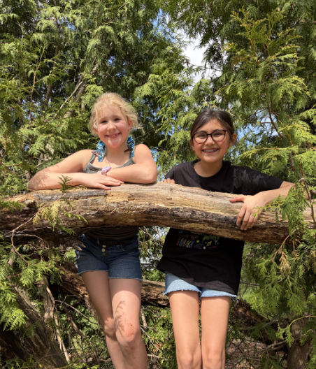 Students hanging out by the trees for Arbor Day