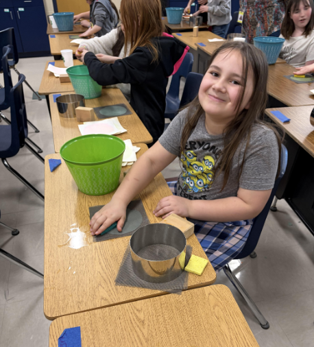 Students learning how to make paper