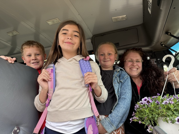 bus driver with student presenting flowers as a gift 2