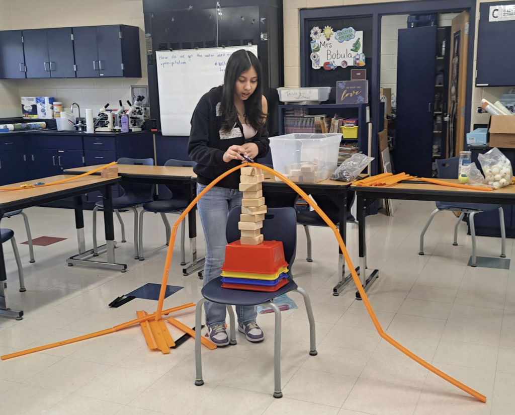 8th grader working on a lab