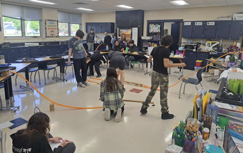 Students working on project demonstrating forces and motion
