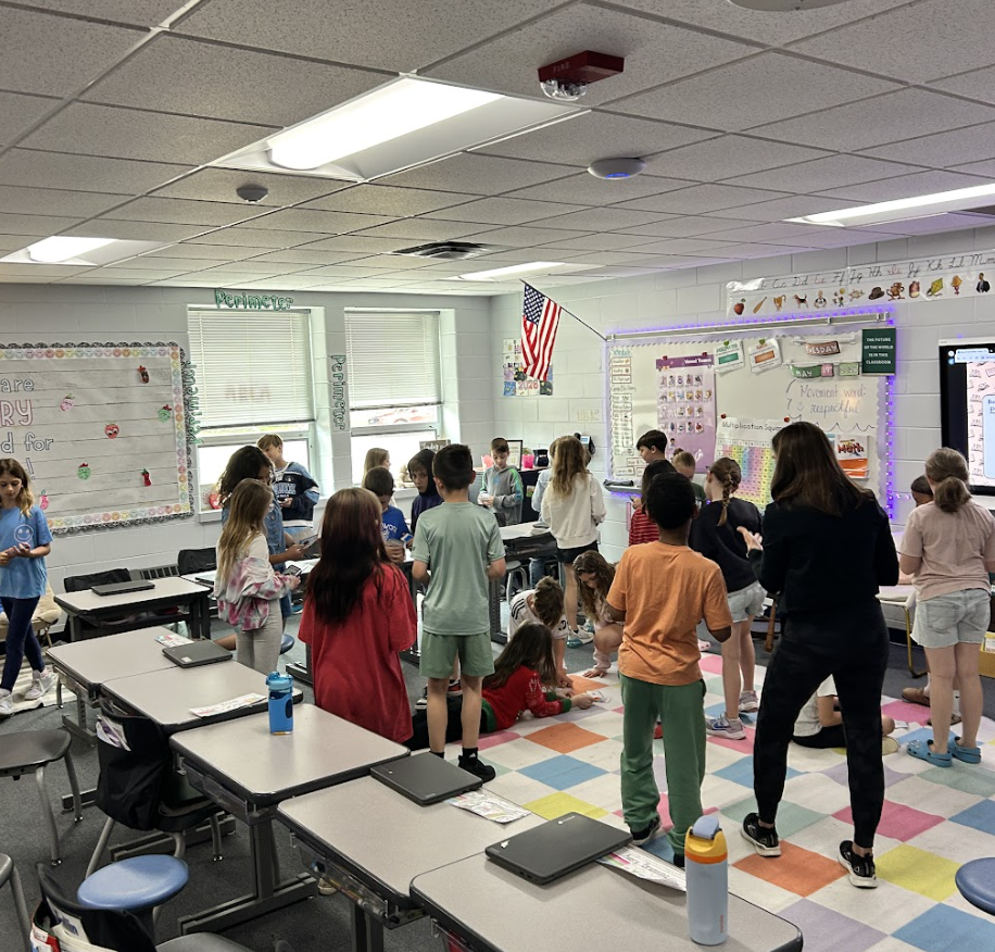3rd graders working on their project