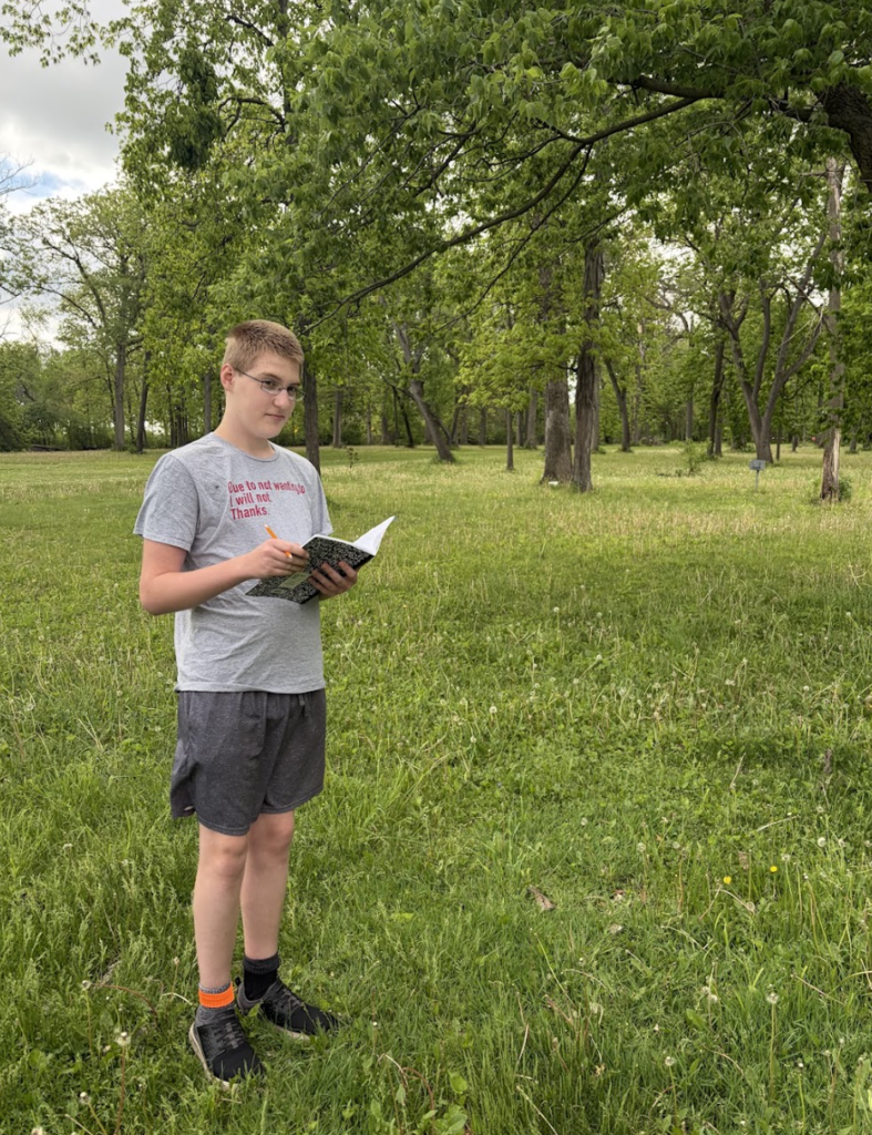 7th grade ELA students took advantage of the beautiful weather today by bringing their creative writing outdoors. As part of their current creative writing unit, students focused on developing strong setting and imagery by paying close attention to the world around them, what they could see, hear, smell, and feel in nature. Using the outdoors as inspiration, students worked to create vivid descriptions that help bring their writing to life.6