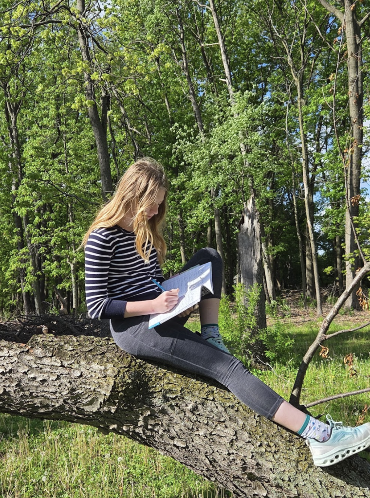 7th grade ELA students took advantage of the beautiful weather today by bringing their creative writing outdoors. As part of their current creative writing unit, students focused on developing strong setting and imagery by paying close attention to the world around them, what they could see, hear, smell, and feel in nature. Using the outdoors as inspiration, students worked to create vivid descriptions that help bring their writing to life. 5