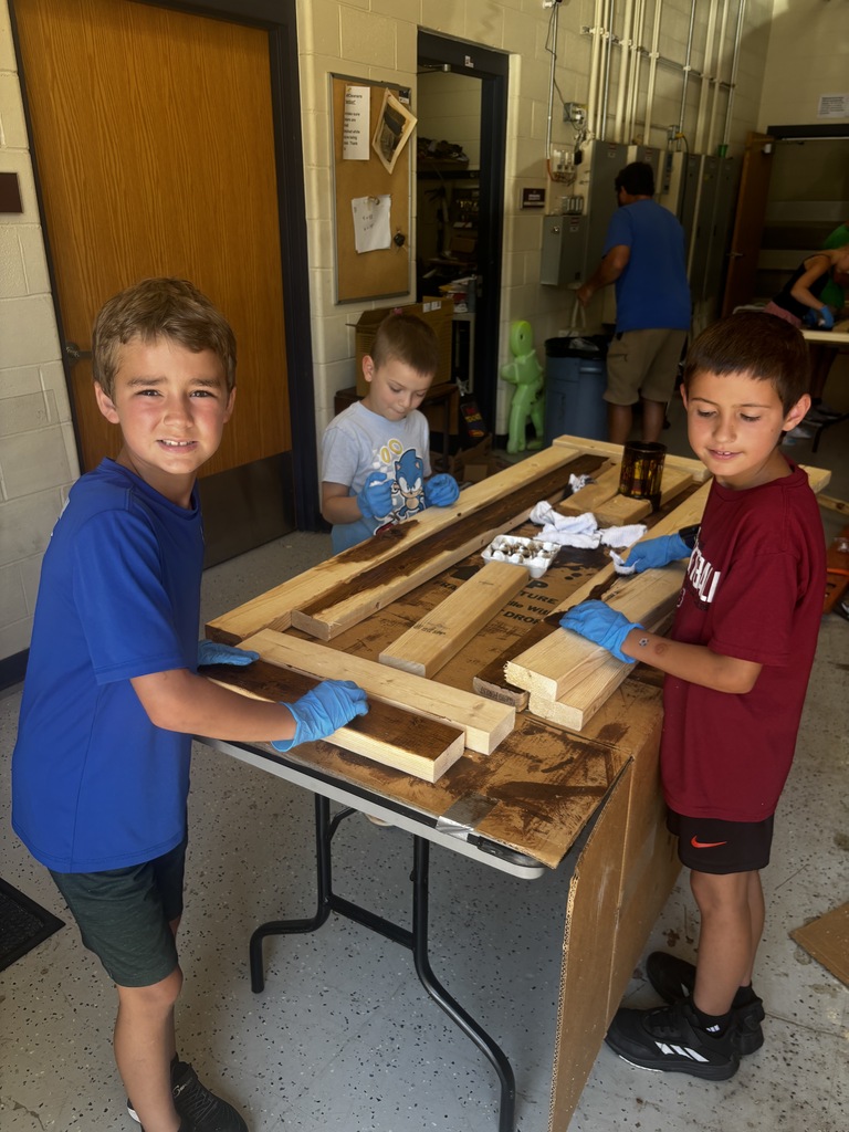 Students staining benches