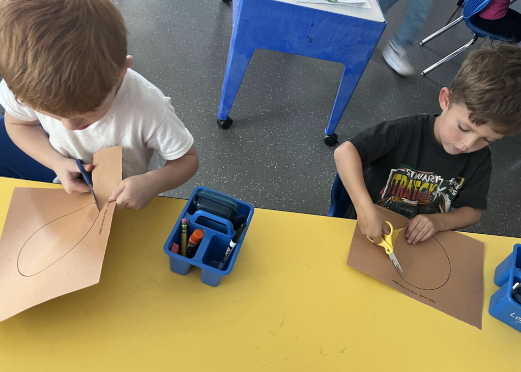 Students cutting out circles