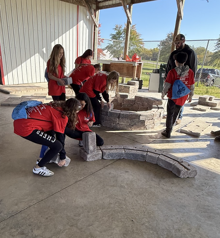 7th and 8th graders laying bricks