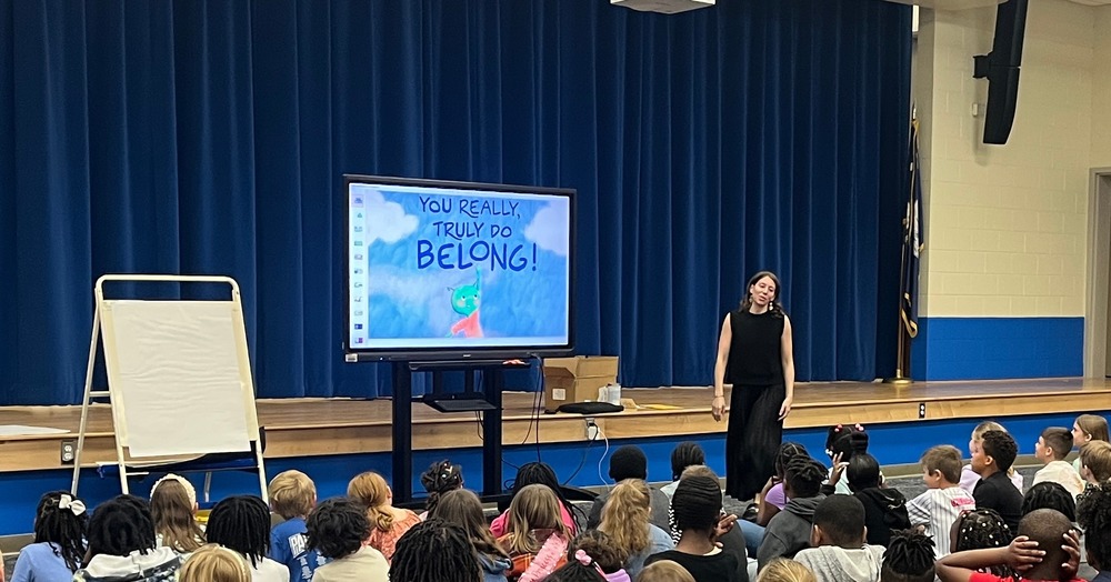 Photo of author sharing with students
