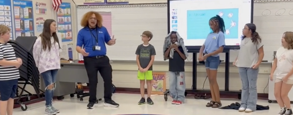 Mr. Moses, PHESA Music Teacher, teaching 5th graders a cool way to introduce themselves. 