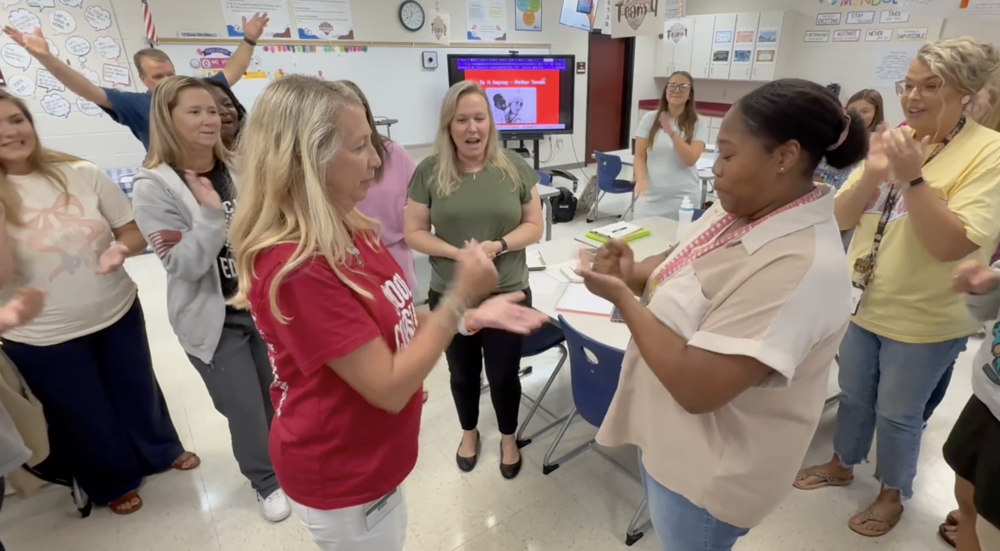PHESA Teachers engaged in a fun competition of Rock Paper Scissors.