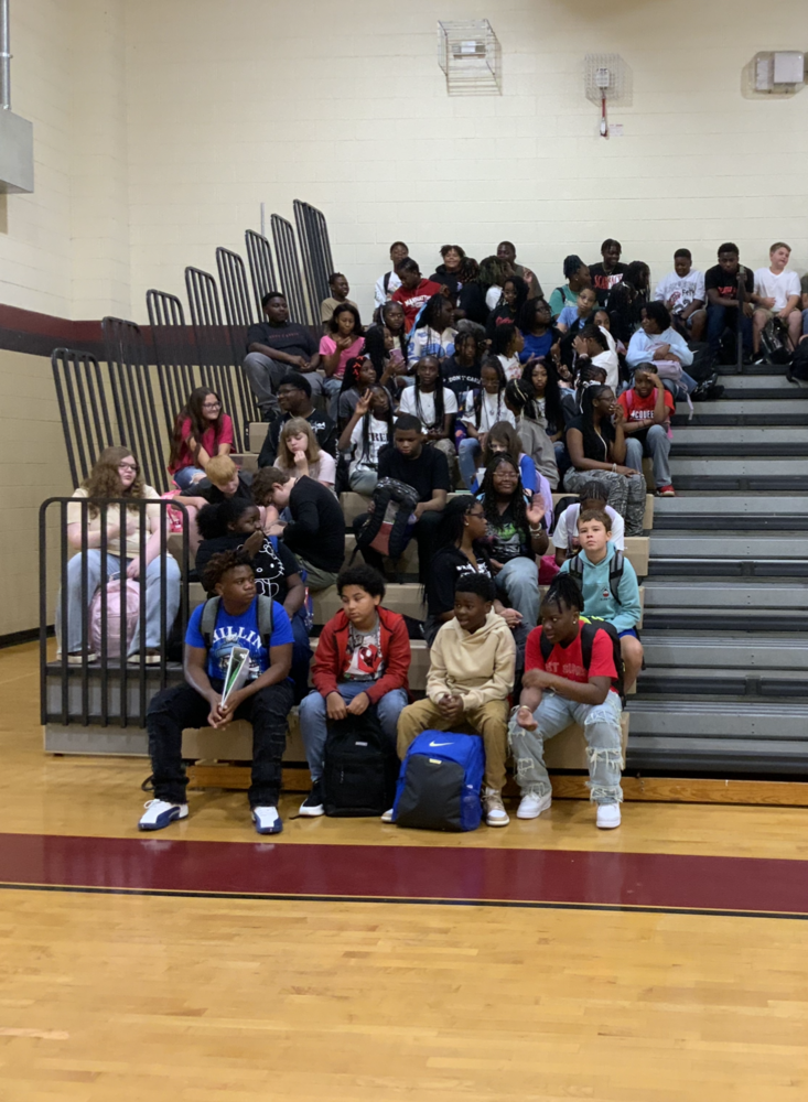 8th grade students sitting in the gym this morning on the first day of school.