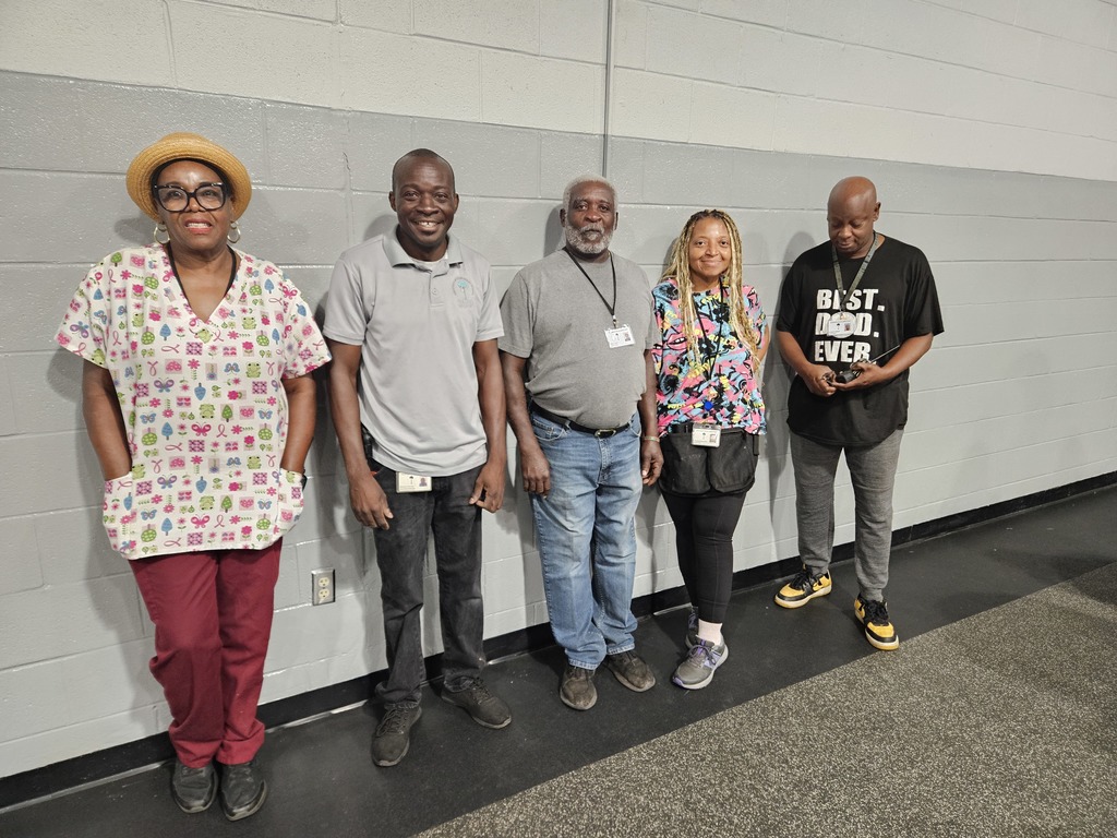 custodians standing at wall