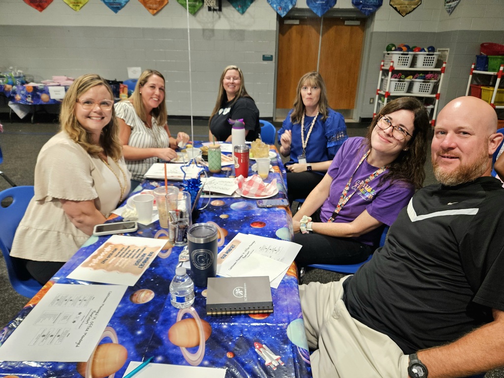 Special Area Team sitting at table