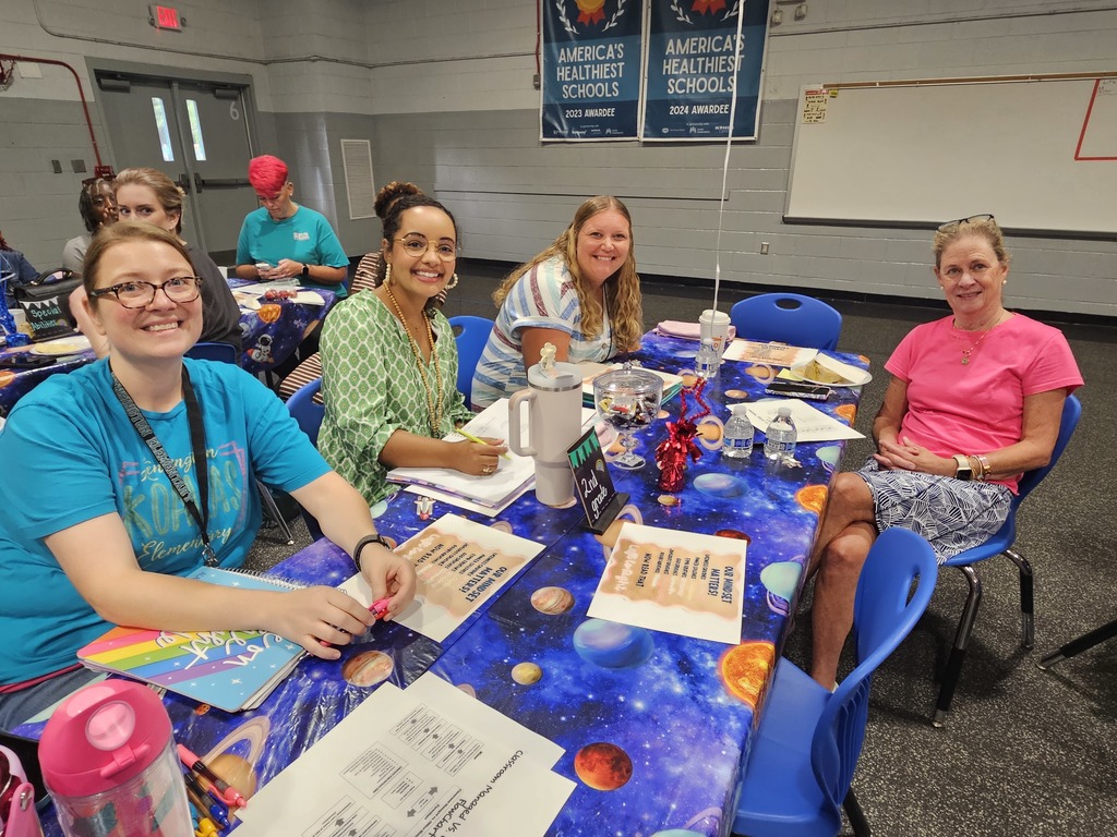 2nd grade team sitting at table