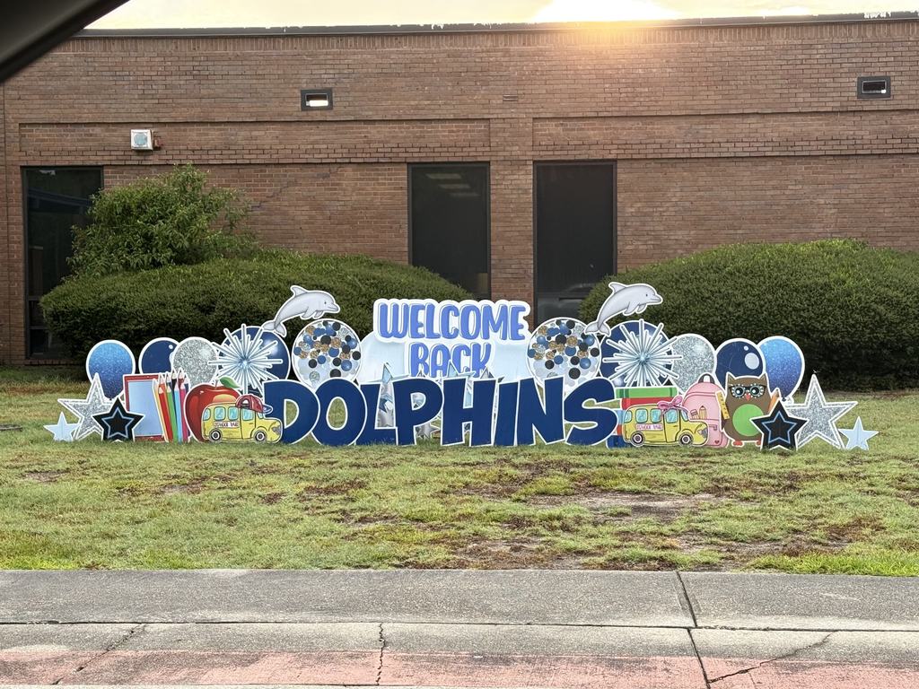 Sign in front of school that states Welcome Back Dolphins