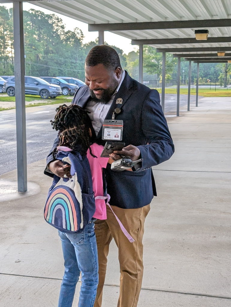 First Day oif School - Assistant prinicpals welcomes student back to school