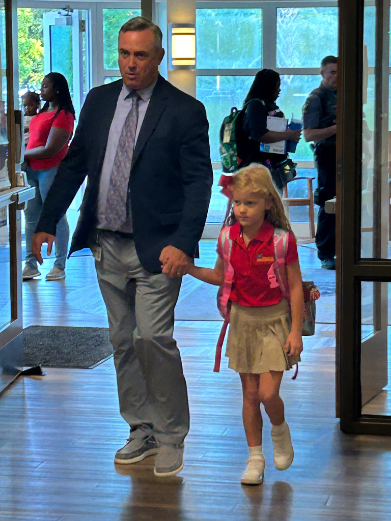 First Day oif School - student and principal walking to class