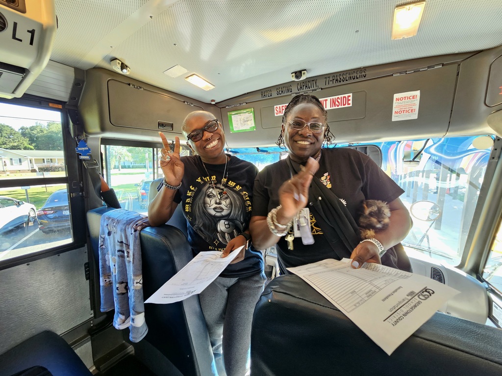 bus drivers standing in bus