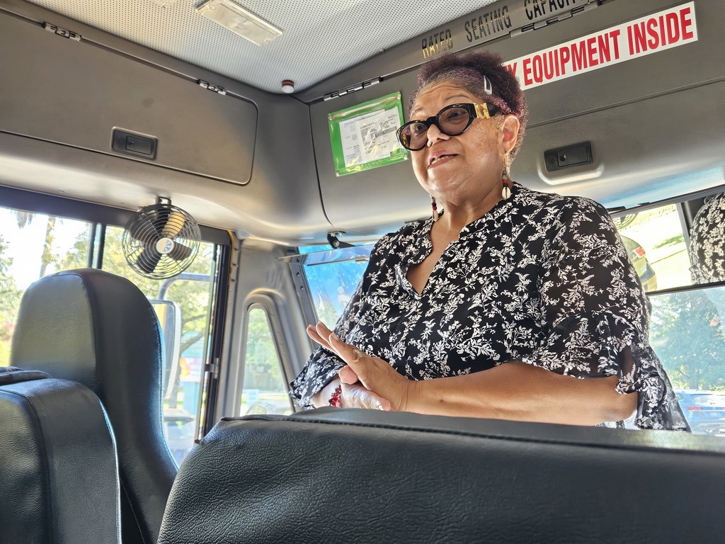 bus driver standing in bus