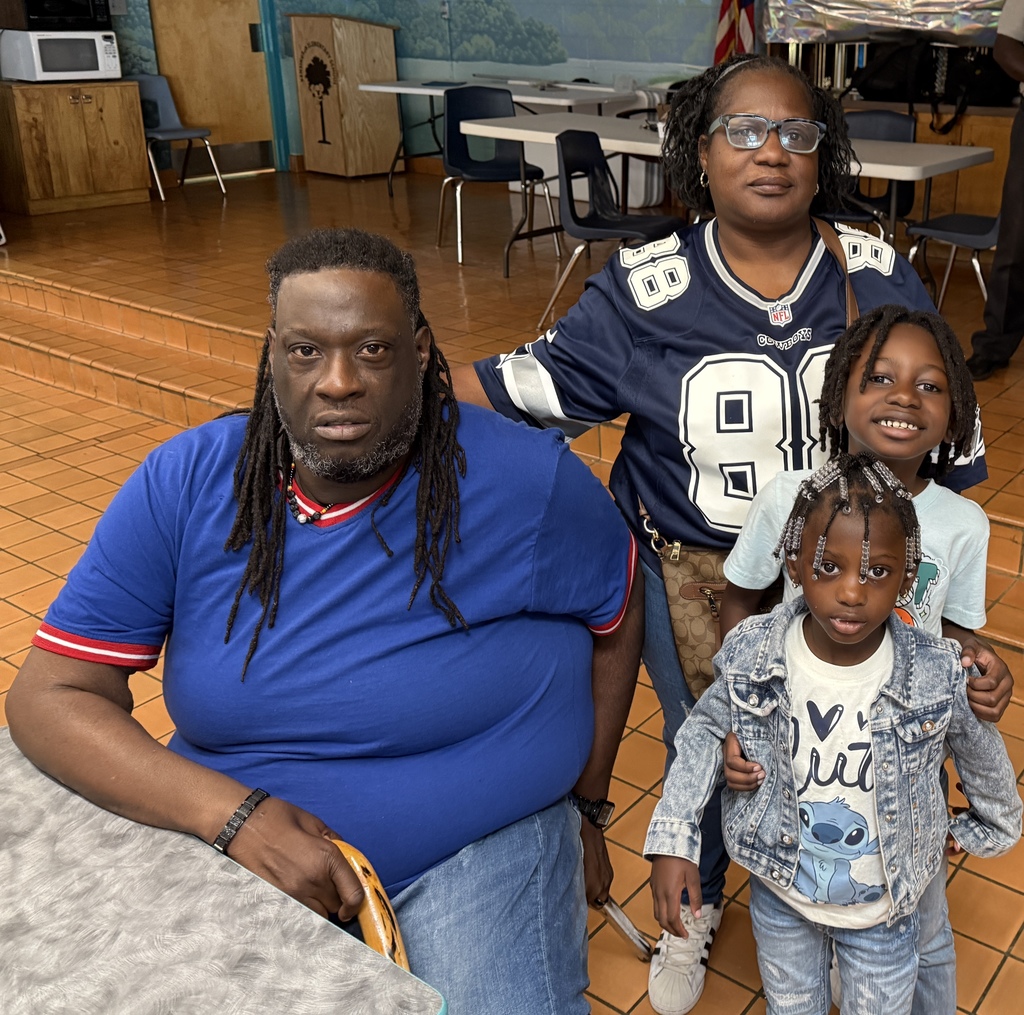 Grandparents with grandchild in cafeteria