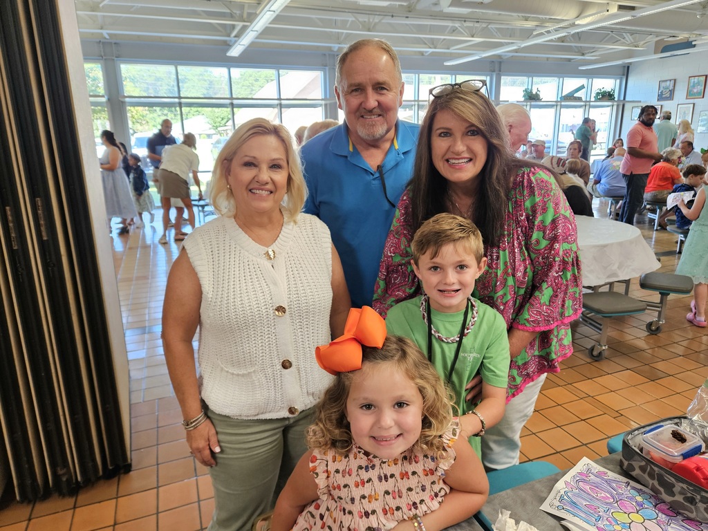 Grandparents with grandchildren in cafeteria