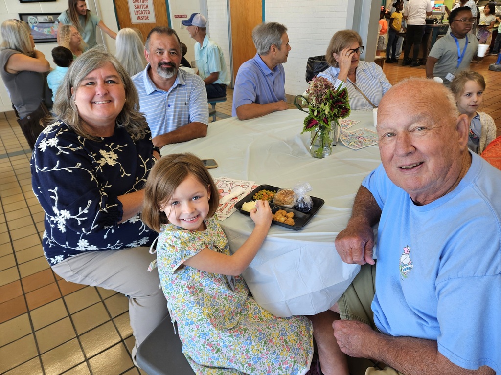 Grandparents with Grandchild in cafeteria
