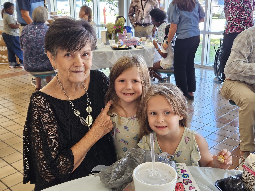 grandmother with grandchildren in cafeteria