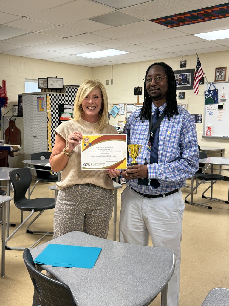 Hello Bear Family! This is a picture of Mr. Edrick Alston, our 7th grade Math teacher, being presented with a certificate by Ms. Stone.