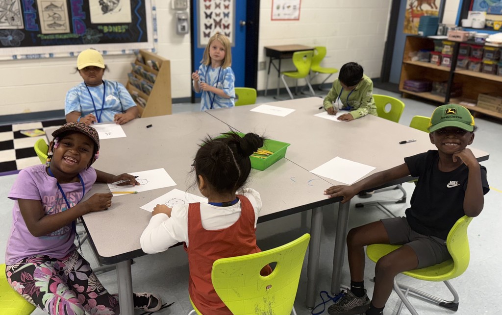 Students sitting at a table.