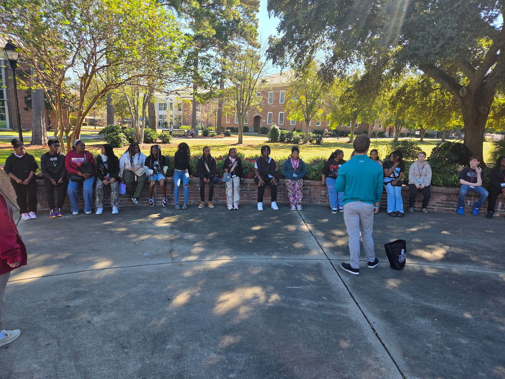 Kids standing in lot at Coastal Carolina .