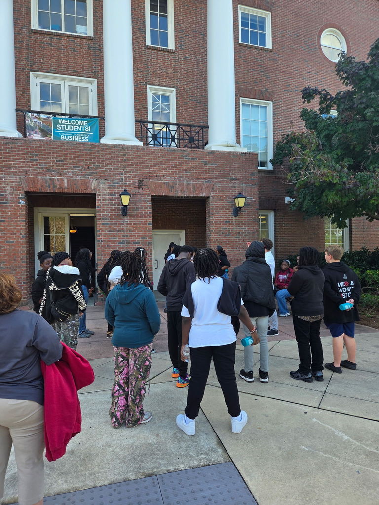 Kids are looking at buildings on campus.
