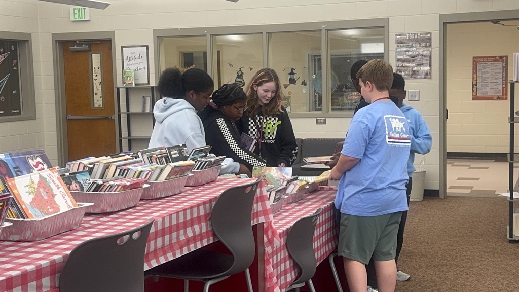 Students sampling the new books in the library.