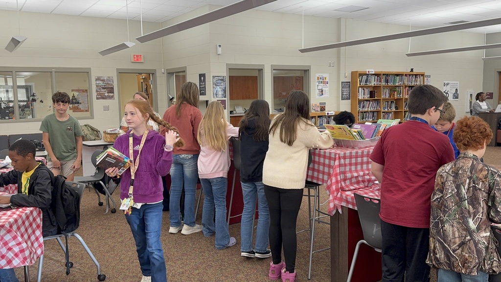 Students looking at books in the Bear Book Buffet!